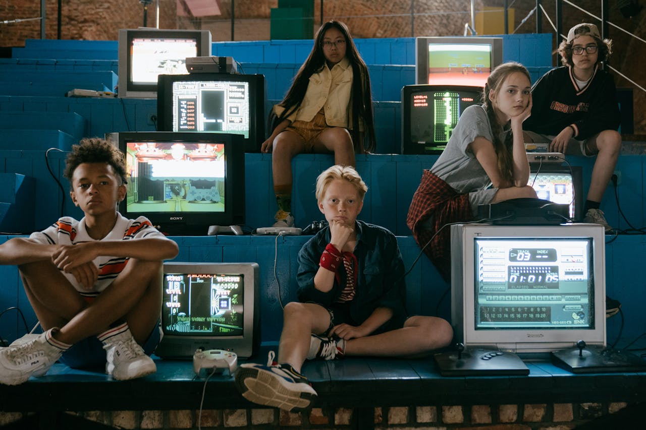 journey Group of teenagers enjoying retro video games with vintage monitors in an arcade setting.